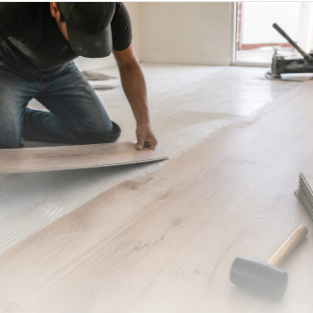 Luxury vinyl plank flooring being installed